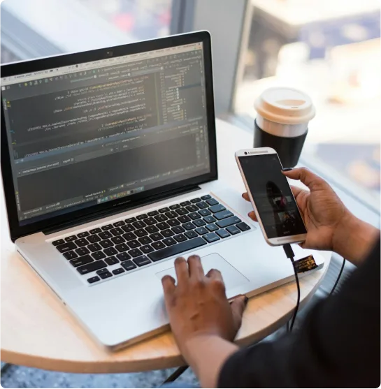 Laptop with coffee on a desk